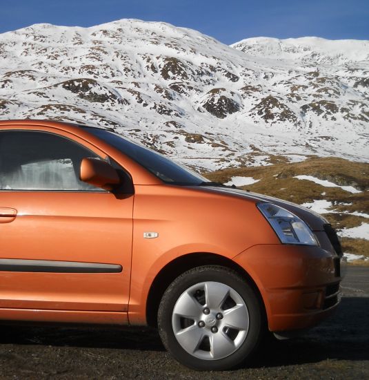 Kia Picanto beneath Meall nan Tarmachan