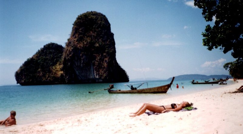 Beach, boats and limestone islets at Hat Tham Phra Nang near Krabi in Southern Thailand