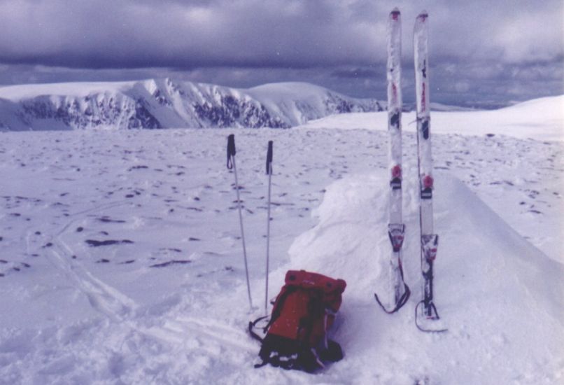 Snowbound summit cairn of Monadh Mor on the Cairngorm Plateau